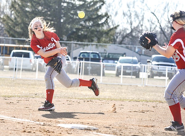 Austin shortstop Shayley Vesel flips the ball to third baseman Lisa Stundahl to get the force out in the third inning against Simley Friday afternoon during the first day of the Elks Invite at Todd Park. Eric Johnson/photodesk@austindailyherald.com