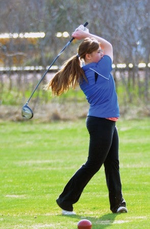 Lyle-Pacelli's Maggie Leif tees off at Meadow Greens Golf Course Monday.