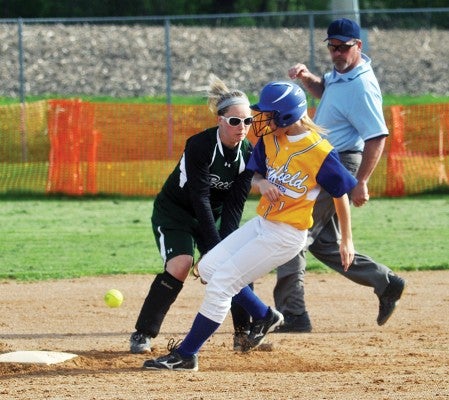 Hayfield's Jessie Foster runs to second base as the ball gets past Waterville-Elysian-Morristown's Danielle Bauer in Hayfield Monday. -- Rocky Hulne/sports@austindailyherald.com