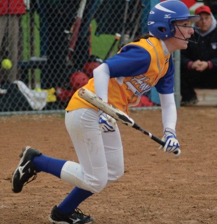 Hayfield's Rachel Masching takes off down the first base line after bunting against Kenyon-Wanamingo in Hayfield Wednesday. -- Rocky Hulne/sports@austindailyherald.com