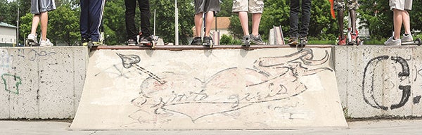 Scooter riders wait for the okay to start their competition during a fundraiser Friday at the Austin skate park to raise money for new equipment.  Eric Johnson/photodesk@austindailyherald.com