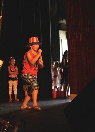 Hunter Tapia, 6, shows off his Karate moves during the Little Miss Sparkler and Mr. Firecracker pageant Wednesday at the Paramount Theatre. 