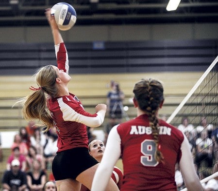 Austin's Erin Dankert spikes against Albert Lea in game two of their match Friday night in Packer Gym.