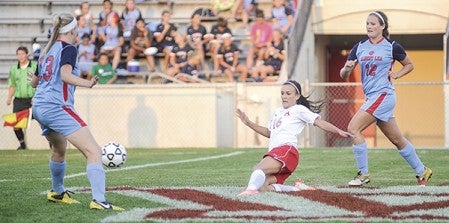 Austin's Madeline Anderson advances the ball during the first half against Albert Lea Thursday night at Art Hass Stadium. Eric Johnson/photodesk@austindailyherald.com