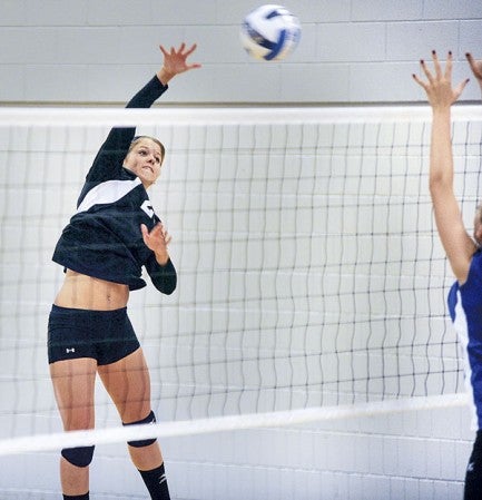 Riverland's Alisa Rudiger spikes in game one against Minnesota West Wednesday night at RCC. Eric Johnson/photodesk@austindailyherald.com