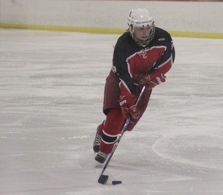 Austin's Lea Semones handles the puck in Albert Lea Tuesday. -- Drew Claussen/Albert Lea Tribune.