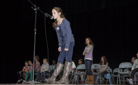 Elyse Hebrink gives an answer during round two of the Austin Public Schools annual Geography Bee during the fifth and sixth-grade competition Tuesday.