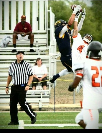 Hayfield grad Evan Bungum battles for a pass while playing football for RCTC. Photo Provided