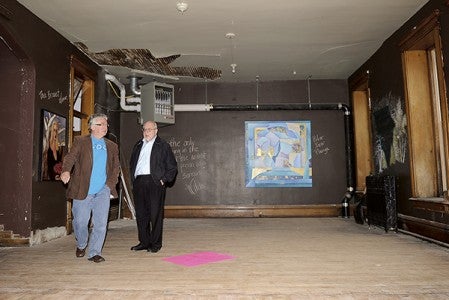 Jerry Girton, left, and Terry Dilley tour the upstairs of the bank building during an open house in September showcasing the potential for a proposed art center. Herald file photo