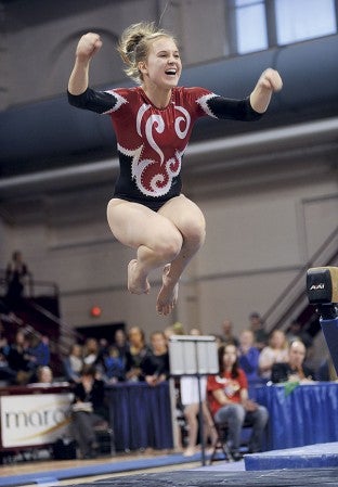 Austin's Sela Fadness explodes after nailing her beam routine during the Minnesota State Class A Individual Gymnastics Meet Saturday at the University of Minnesota Sports Pavilion in Minneapolis. Eric Johnson/photodesk@austindailyherald.com