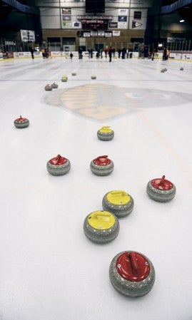 Curling stones speck the ice at Riverside Arena Saturday. 