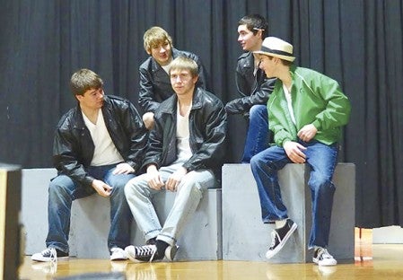 Members of the cast of “Grease” rehearse in the Southland Auditorium recently. The cast, consisting of players from Southland, LeRoy-Ostrander and Sacred Heart School, have dedicated the show to memories of Tess Landherr and Phillip Richer. Photos provided