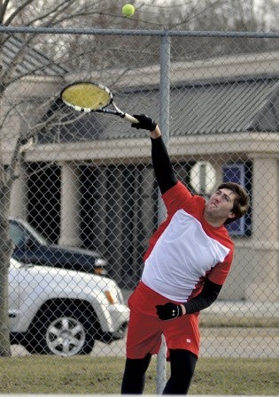 Austin's Carter Steichen delivers a serve against Fairmont in a No. 1 doubles match in Paulson Courts Monday. -- Rocky Hulne/sports@austindailyherald.com