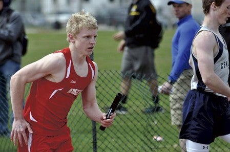 Austin's Connor Sheehan runs in the 4 x 400-meter relay in the while competing for the Packers. Herald File Photo