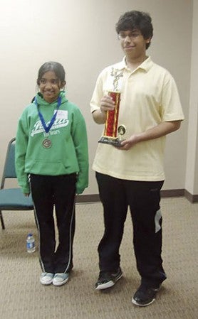 Shane DeSilva with his sister Shenali DeSilva at a spelling bee earlier this year. Photo provided