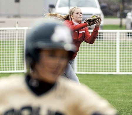 Austin leftfield Erin Dankert runs up to make the catch to end an inning against Rochester Mayo Thursday evening at Todd Park. Eric Johnson/photodesk@austindailyherald.com