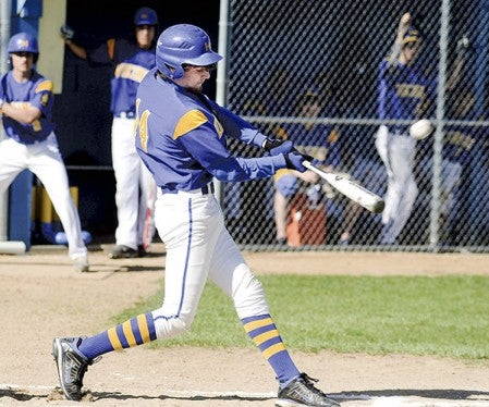 Hayfield catcher Connor Nelson lifts and RBI double in the first inning against Lyle-Pacelli Thursday during Section 1A West Division playoff action in Hayfield. Eric Johnson/photodesk@austindailyherald.com