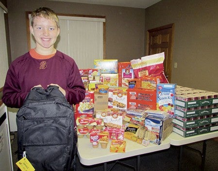 Layne Vaupel helped spread the word about the backpack program and brought in more than 60 meals to area students. Photo provided