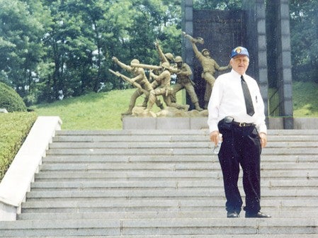 Norman Mathews stands at the memorial in Osan, South Korea, on a trip in 1992. Photo provided