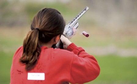 A spent shell is ejected from the shotgun of Taylor Derry during a shoot last week at the Cedar Valley Conservation Club.  Eric Johnson/photodesk@austindailyherald.com