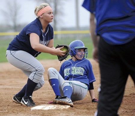 Lyle-Pacelli's Samantha Hinz slides into third base as Glenville-Emmons third baseman Bre Lundmark looks to throw the ball home Monday in Game 1 of a home doubleheader against Lyle/Pacelli. The Athletics won 4-3. — Micah Bader/Albert Lea Tribune.