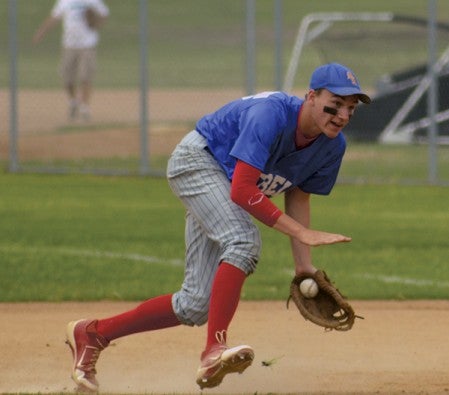 Southland's Lukas Anderson scoops up a ground ball at first base in a 1-0 loss to Chatfield in a Section 1A tournament game at RCTC in Rochester Saturday. -- Rocky Hulne/sports@austindailyherald.com