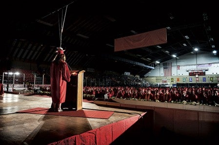 Austin commencement speaker Tori Grev addresses classmates Friday night at Riverside Arena. Eric Johnson/photodesk@austindailyherald.com