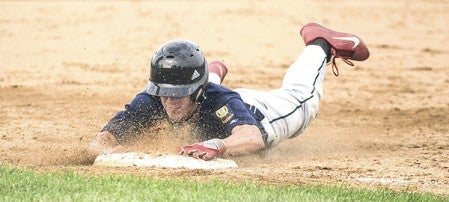 Austin Legion Post 91's Daniel Bollingberg slides into first during game one against Rochester Tuesday night at Riverland Community College. Eric Johnson/photodesk@austindailyherald.com