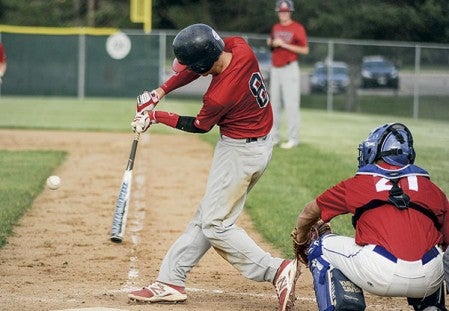 Austin VFW Post 1216's Dylan Gasner swings on a pitch in the second inning against Faribault Wednesday night at Riverland Community College. Eric Johnson/photodesk@austindailyherald.com