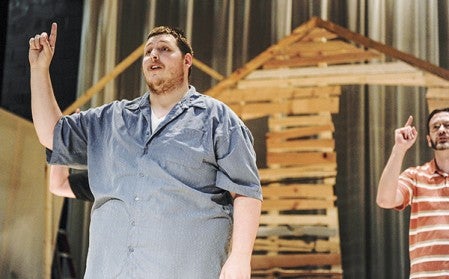 Robert Johnson, playing the part of Tevye, rehearses with the cast of The Summerset Theatre production of the "Fiddler on the Roof" Tuesday night at Frank W. Bridges Theatre. Eric Johnson/photodesk@austindailyherald.com