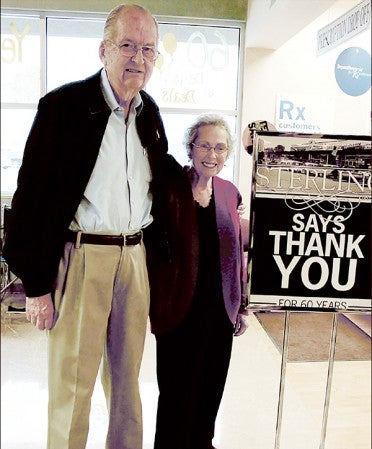 Leonard Astrup, left, founder of Sterling Drug in Austin passed away last Tuesday. In this photo, he  stands with longtime employee Sharon Wagner during the company's 60th Anniversary. Wagner started with the business from the beginning and worked until 1994. Herald file photo