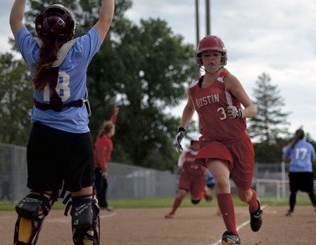 Justine Reimers scores a run for the Austin 16U softball team in Todd Park Monday. -- Rocky Hulne/sports@austindailyherald.com