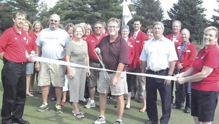 Ambassadors welcomed Cedar River Golf Course to the Austin Area Chamber of Commerce with a ribbon cutting on the course near Adams. Pictured at center are Course Manager Mike Stark, board president Mike Schneider and board members Brad Emanuel and Cathy Sumner. 