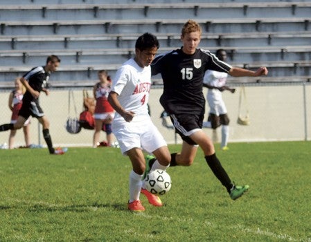 Roel Torres handles the ball against Byron in Art Hass Stadium Saturday. -- Rocky Hulne/sports@austindailyherald.com