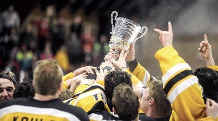 The Austin Bruins hold up the NAHL Central Cup after defeating the Bismarck Bobcats in game 5 of the Central Division finals last season. Herald file photo