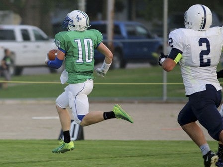 Lyle-Pacelli's Braden Kocer runs an interception back for a touchdown against Glenville-Emmons in Lyle Friday. -- Photo Provided by Faye Bollingberg