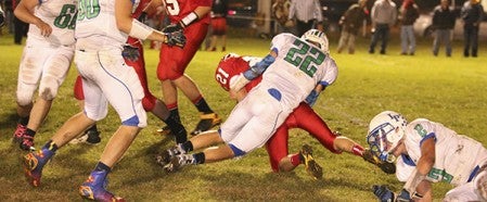 Lyle-Pacelli's Brady Lester finishes off a tackle on LeRoy-Ostrander's Jacob Souhrada Wednesday night in LeRoy.  Photo provided by Faye Bollingberg