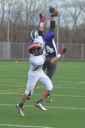 Grand Meadow's Connor Hartson reaches up to haul in a pass against Underwood in Irondale Saturday. -- Rocky Hulne/sports@austindailyherald.com