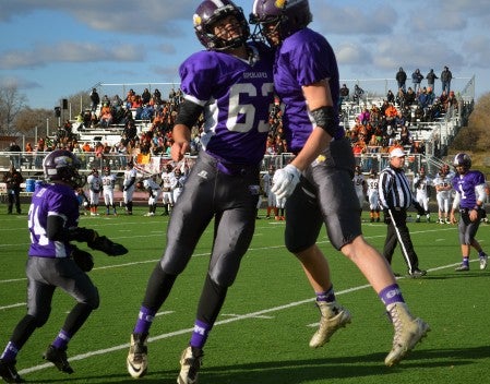 Grand Meadow's Trevor Sloan and Blake Benson celebrate during Grand Meadow's 20-0 win over Underwood in Irondale Saturday. -- Rocky Hulne/sports@austindailyherald.com