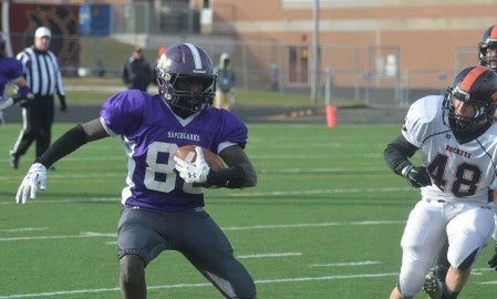 Grand Meadow's Cody Ojulu runs down the sideline against Underwood in Irondale in the Class nine man state quarterfinals Saturday. -- Rocky Hulne/sports@austindailyherald.com