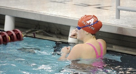 Maddie Kinney of Austin looks back at the scoreboard after swimming the last leg of the 200-yard freestyle relay Thursday in the Class A state prelims at the University of Minnesota Aquatic Center. The team qualified for finals by finishing 13th with a time of 1:42.12. — Micah Bader/Albert Lea Tribune