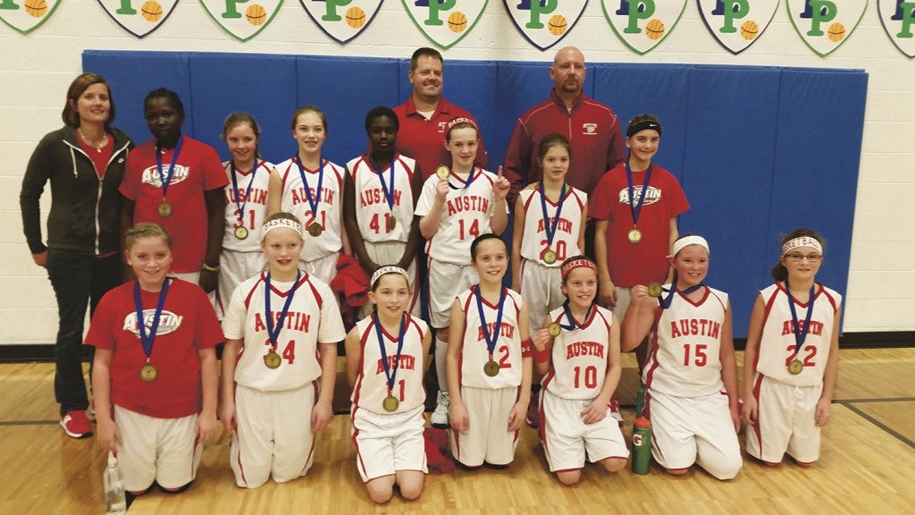 Austin fifth grade girls took first place in two tournaments over the weekend and they are now 11-1 this season. Back row (left to right): Coach Brian Schneider and Coach Steve Venenga. middle row:  Coach Kacy Vanderhorst, Nybol Deng, Claire Connett, Reana Schmitt, Joy Deng, Mallory Brown, Hannah Case and Jaeda Bekaert; front row: Audrey Schneider, Alana Rogne, Megan Silbaugh, Hope Dudycha, Emma Dudycha, Jilian Venenga and Kendall Gilster. -- Photo provided