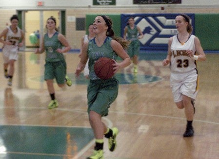 Brooke Walter gets free on a breakaway for Lyle-Pacelli in Pacelli Gym Monday. -- Rocky Hulne/sports@austindailyherald.com