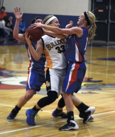 Southland's Sydney Bendtsen, right, plays pressure defense on Sarah Hart of PEM in Adams Thursday. -- Rocky Hulne/sports@austindailyherald.com