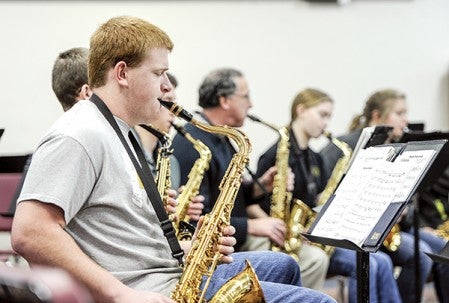 Brad Gerlach plays with the saxophone section during an early-morning rehearsel for the upcoming Paramount Jazz Show. Eric Johnson/photodesk@austindailyherald.com