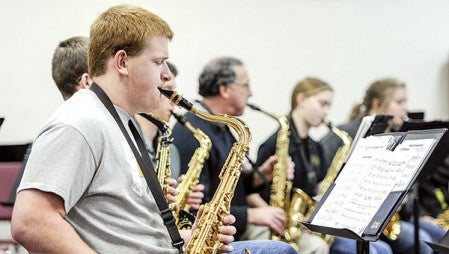 Brad Gerlach plays with the saxophone section during an early-morning rehearsel for the upcoming Paramount Jazz Show. Herald file photo