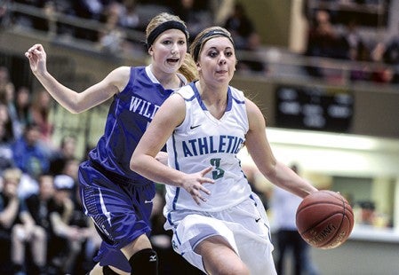 Lyle-Pacelli's Courtney Walter drives the lane during the first half of the Section 1A West championship against Goodhue Saturday night at Mayo Civic Center in Rochester. Eric Johnson/photodesk@austindailyherald.com