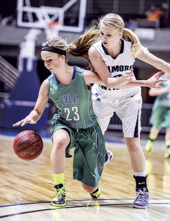 Lyle-Pacelli's Brooke Walter fends off Fillmore Central's Tayah Barnes during the first half of the Section 1A championship game at Mayo Civic Center in Rochester Friday. Eric Johnson/photodesk@austindailyherald.com