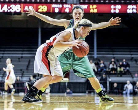 Lyle-Pacelli's Courtney Walter pressure's Ada-Borup's Lexi Nelson during the Class A Minnesota Girls State Basketball Tournament in Williams Arena Friday. Eric Johnson/photodesk@austindailyherald.com