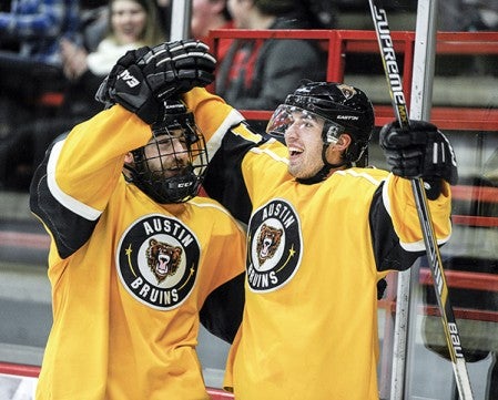 Austin's Ian Scheid, right, celebrates his second-period goal against the Aberdeen Wings in game one of their playoff series Friday night at Riverside Arena. Eric Johnson/photodesk@austindailyherald.com